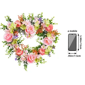 Valentine's Day heart-shaped floral wreath with pink roses and lush greenery wedding decor