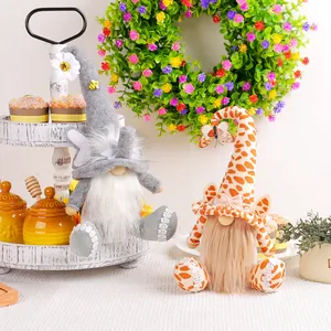 Handmade animal-themed plush gnomes with elephant and giraffe patterns for home decor