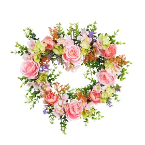 Artificial heart-shaped floral wreath with pink roses for wedding and Valentine's Day decor