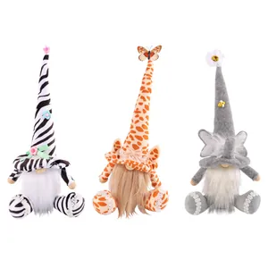 Set of three animal themed faceless gnome dolls featuring zebra giraffe and elephant patterns