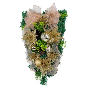 Elegant golden Christmas teardrop swag with pine needles and glitter poinsettias