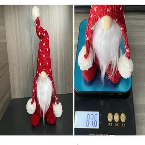 Close-up of a festive Christmas gnome plush doll on a digital scale weighing 87.6 grams
