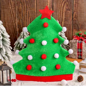 Detail view of a green felt Christmas tree hat with red star and festive pom-poms.