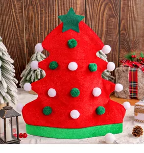 Detail of red Christmas tree felt hat with colorful pompoms and a green star top