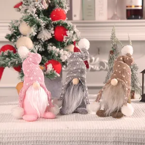 Set of three Christmas gnome dolls with knitted hats and fur beards for holiday decor
