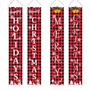 Detailed view of red and black plaid Christmas door banners with festive holiday greetings