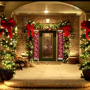 Red and black plaid Merry Christmas door banners displayed on a decorated holiday porch