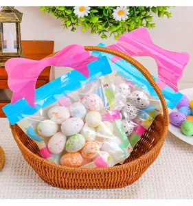 Close-up of colorful speckled foam Easter eggs in festive pink bow gift bags