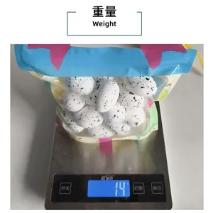 Digital scale measuring the weight of a package of DIY speckled foam Easter eggs.