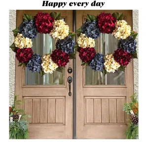 Pair of red white and blue Independence Day hydrangea wreaths on a wooden front door