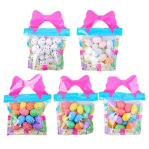 Decorative set of 5 Easter speckled foam eggs in gift bags with pink bow handles for party