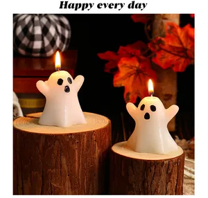 Warm glowing ghost-shaped candles on wooden stumps for Halloween decor.