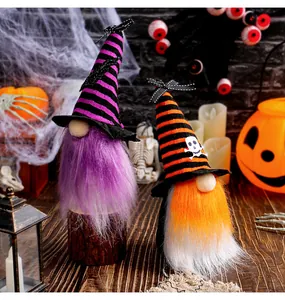 Detailed view of two decorative Halloween gnomes wearing striped wizard hats with skulls