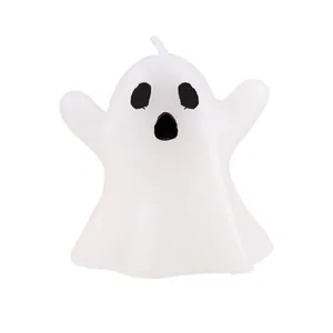 Cute white ghost shaped candle for Halloween atmospheric holiday home decoration