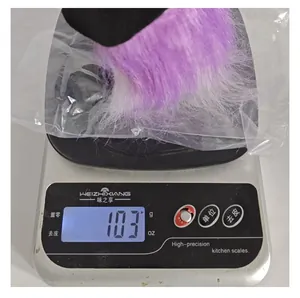 Halloween wizard hat doll weight measurement showing 103g on digital scale