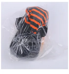 Detailed view of the Halloween wizard hat doll ornament inside a clear plastic bag