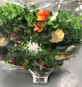 Autumn eucalyptus wreath with mini pumpkins weighing approximately 378.5g on a digital scale