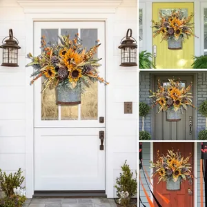 Autumn harvest sunflower and pine cone wreath in rustic metal basket for front door decoration