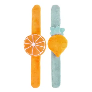 Cute plush slap bracelets for kids featuring cartoon orange and carrot designs on white.