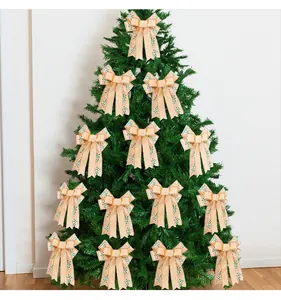 Detailed view of beige double-layer Christmas bows decorating a green festive tree