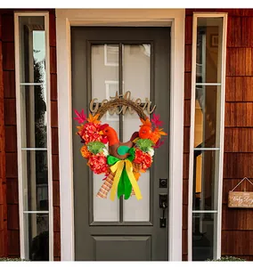 Close-up of Thanksgiving chicken wreath with colorful hydrangea and maple leaves on a door