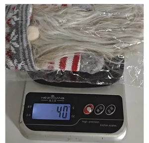 Detailed weight measurement showing 40g for the knitted Christmas gnome wine bottle cover