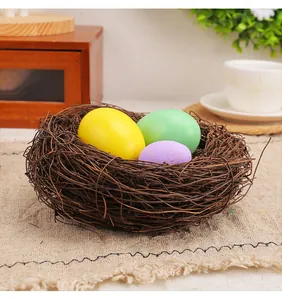 Natural rattan Easter bird nest decoration with colorful eggs on rustic burlap background