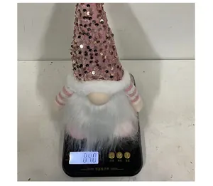 Detailed view of a sequined Christmas gnome showing a weight of 84.0 grams