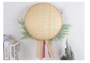 Handmade bamboo basket Christmas wreath with green pine needles and burlap ribbon