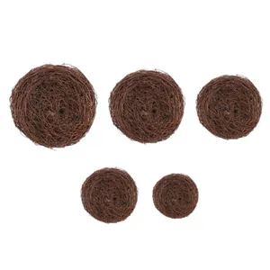 Set of five different sized handmade brown woven twig bird nests for Easter DIY decor