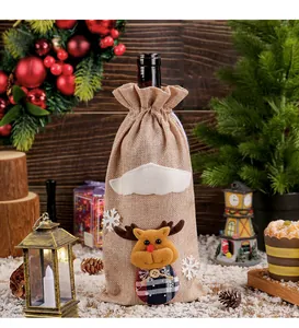 Burlap wine bottle cover featuring a cute reindeer doll in a festive Christmas setting