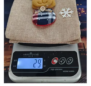 Detail view showing the 29-gram weight of a burlap Christmas wine bottle gift bag