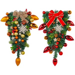 Decorative artificial Christmas teardrop swags with bows and snowflake wood cutouts