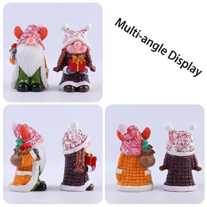 Pair of Christmas gnome resin figurines for holiday table decoration in multi-angle view