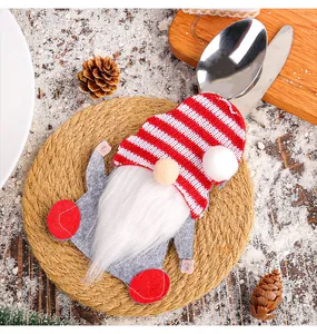Christmas gnome felt cutlery holder detail with festive red and white striped hat