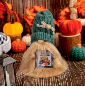 Close-up of a Harvest Festival gnome doll holding a decorative Welcome to our patch sign