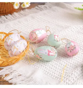 Detailed view of colorful Easter hanging foam eggs with cute bunny and floral patterns.