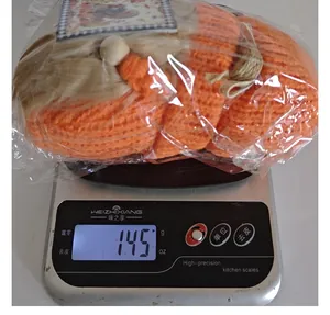 Harvest Festival knitted gnome doll weighing 145g on a digital scale