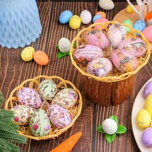 Set of decorative Easter foam eggs with rabbit and floral patterns in yellow woven baskets