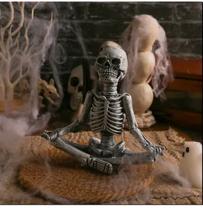 Macro view of the weathered resin yoga skeleton figurine for Halloween desktop decor