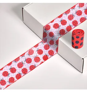 Close-up of red and black polka dot ladybug ribbon for creative gift packaging