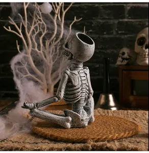 Detailed side view of a resin yoga skeleton meditating in a spooky Halloween setting