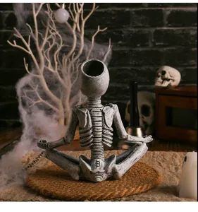 Detailed view of resin yoga skeleton figurine for spooky Halloween desktop decor