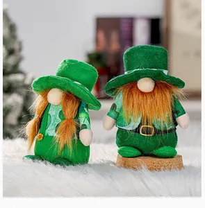 Close-up of adorable St. Patrick's Day gnomes with green felt hats and orange braids.