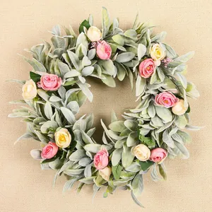 Detailed view of artificial lamb's ear wreath with delicate pink and cream roses