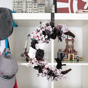 Halloween moon wreath with black and white roses and black cat silhouette
