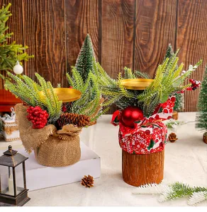 Decorative Christmas candle holder details featuring red berries, pine needles and cones.