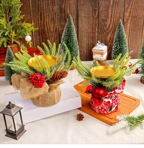 Detailed view of festive Christmas candle holders with pinecones and red berries