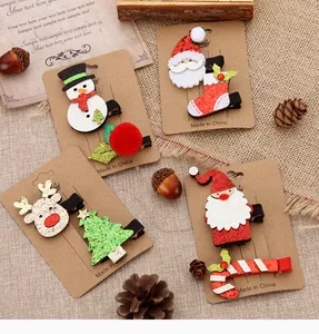Close-up of festive Christmas hair clip set featuring Santa, Reindeer and Tree designs.