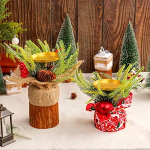 Festive Christmas candle holders with pine needles, red berries, and burlap base decoration